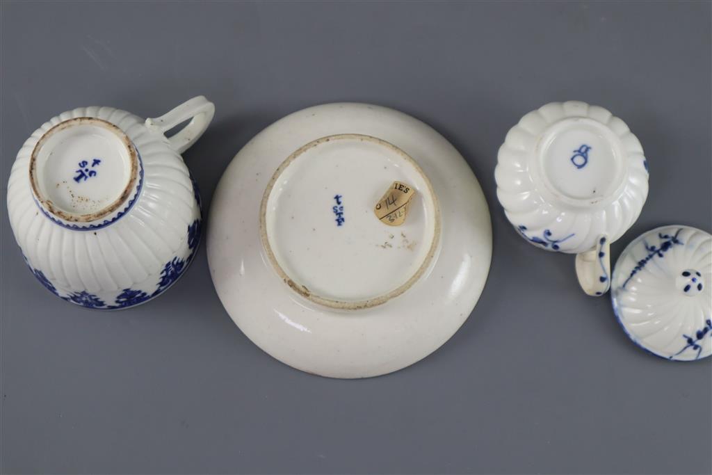 A St. Cloud cup and trembleuse saucer, c.1725-1740 and a Chantilly custard cup and cover, c.1750, (4)